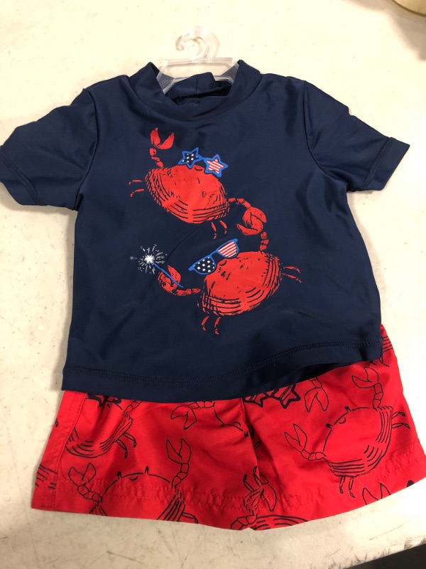 Photo 1 of Carter's Just One You® Baby Boys' 2pc Short Sleeve Crab Print Rash Guard Set - Red/White/Blue, SIZE 6M 