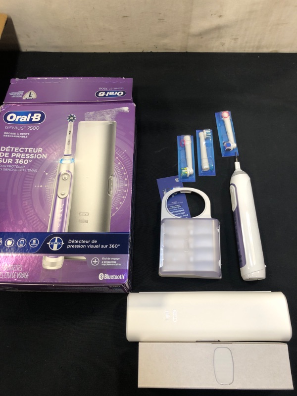 Photo 2 of Oral-B 7500 Electric Toothbrush with Replacement Brush Heads and Travel Case, Orchid Purple ( USED ITEM )
