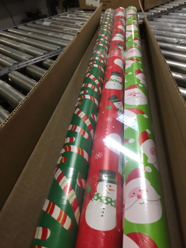 Photo 2 of American Greetings Reversible Christmas Extra-Wide Wrapping Paper Bundle, Santa, Snowmen and Candy Canes (3 Rolls, 120 sq. ft.)