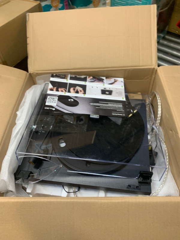 Photo 3 of Pro-Ject Automat A1, Fully Automatic Turntable System with pre-Adjusted OM 10 Cartridge and Built-in switchable Moving Magnet (MM) Phono Stage, Black --- Selling for Parts, Item Did Not Turn On, Missing Parts, Box Packaging Damaged
