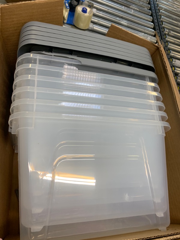 Photo 3 of Amazon Basics 19 Quart Stackable Plastic Storage Bins with Latching Lids- Clear/ Grey- Pack of 6 19 Qt. - 6 Pack --- Box Packaging Damaged, Moderate Use, Scratches and Scuffs on Plastic, Plastic Broken in places, Missing some Parts
