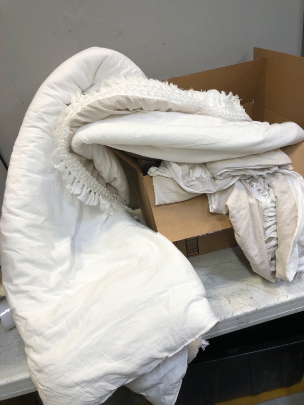 Photo 1 of  REVERSIBLE WHITE AND OFF WHITE COMFORTER 