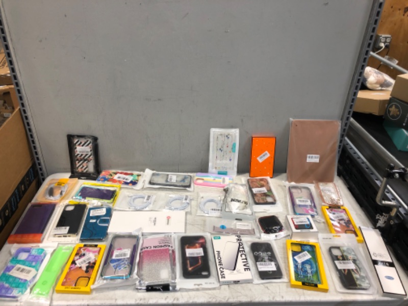 Photo 1 of Assortment of cases, chargers, and watch bands
