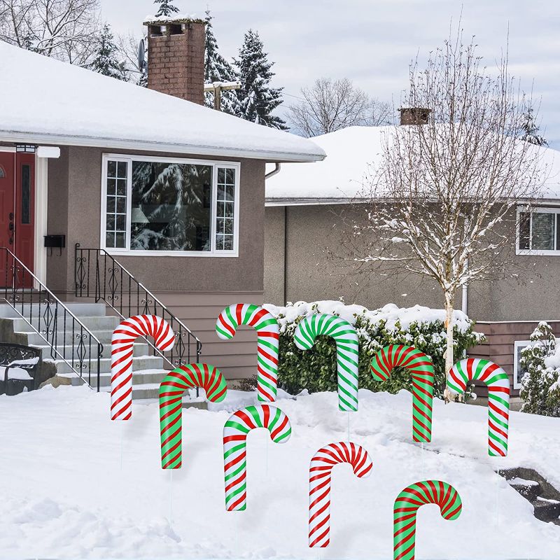 Photo 1 of 24 Pcs Candy Cane Christmas Decoration Outdoor Candy Cane Lawn Yard Sign with Stakes Waterproof Corrugated Candy Decorations Christmas Yard Stakes Candy Garden Sign for Xmas Pathway Walkway Decoration
