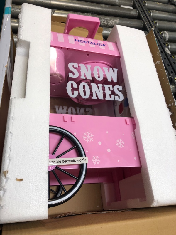 Photo 3 of Nostalgia Vintage Countertop Snow Cone Machine - Slushie Machine - Shaved Ice Machine and Crushed Ice Maker - Makes 20 Icy Treats, Includes 2 Reusable Plastic Cups & Ice Scoop – Pink