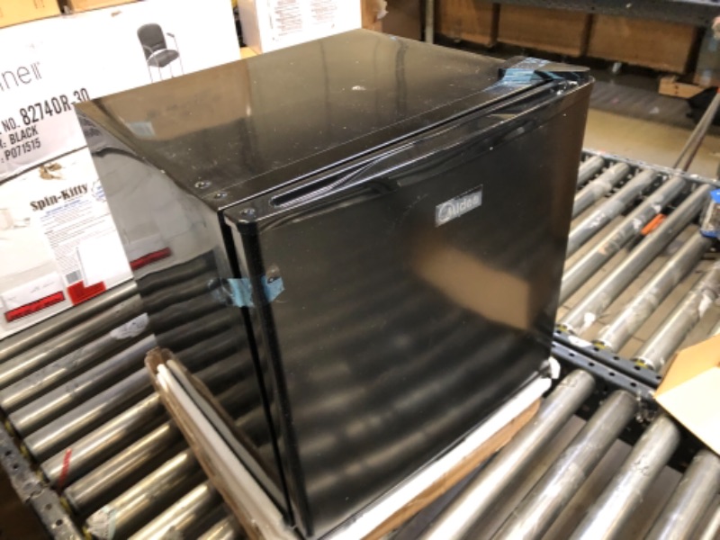 Photo 4 of Midea WHS-65LB1 Compact Single Reversible Door Refrigerator, *markings/dirty exterior* 1.6 Cubic Feet(0.045 Cubic Meter), Black Black 1.6 Cubic Feet Refrigerator