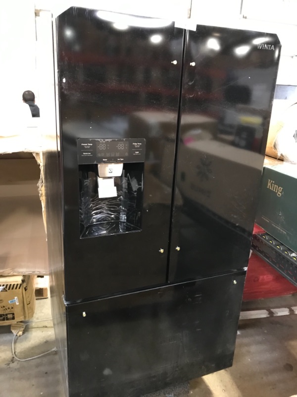 Photo 2 of 25.5 CU. FT. FRENCH DOOR REFRIGERATOR WITH ICE & WATER DISPENSER - BLACK

This Winia 25.5 cu. ft. French Door refrigerator is beautifully designed with a Filtered Ice & Water Dispenser and a Fingerprint Resistant Finish that holds magnets. The fridge is l