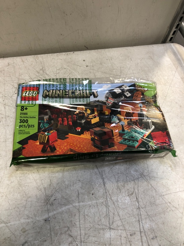 Photo 1 of LEGO Minecraft The Nether Bastion 21185 Building Toy Set for Kids, Boys, and Girls Ages 8+; Includes 2 Zombies and a Zombie Hunter; Fun Gaming Gift (300 Pieces), Multicolor ( BOX HAS MINBOR DAMAGE )