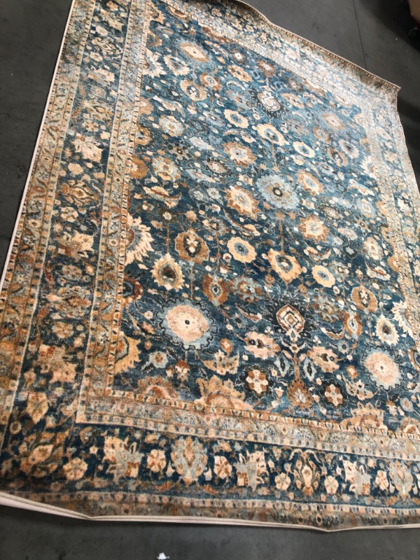 Photo 1 of **USED, NEEDS CLEANING**
7.9 X 9.10 TEAL,ORANGE DESIGN RUG