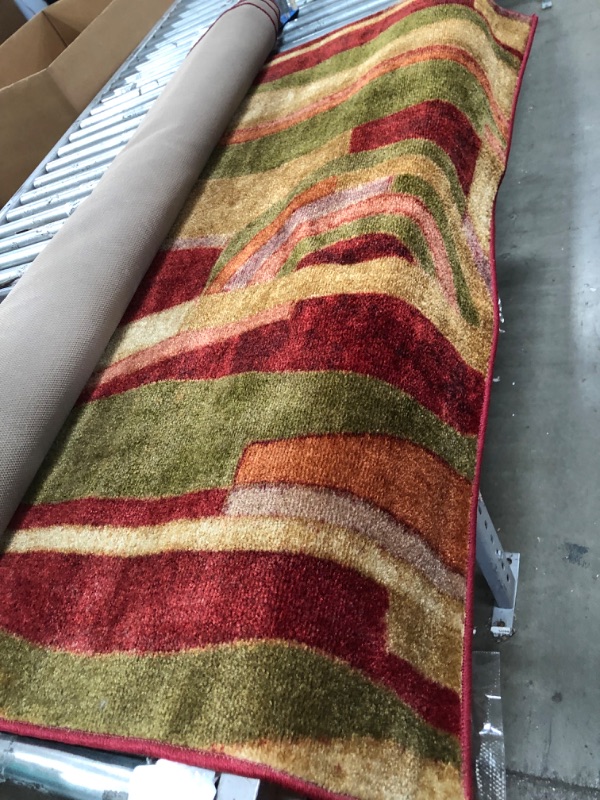 Photo 1 of **USED, NEEDS CLEANING**
Mohawk New Wave Picasso Area Rug - 5 X 8
