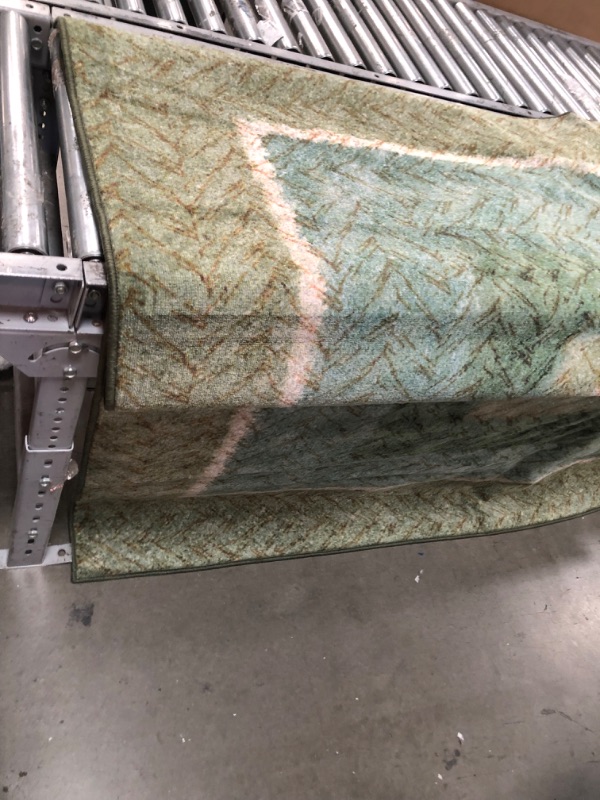 Photo 3 of **USED, NEEDS CLEANING**
7'9"FT X 14 FT GREEN, TEAL & TAN RUG