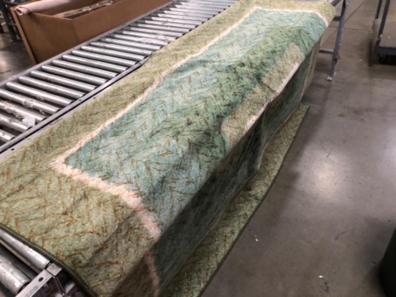 Photo 5 of **USED, NEEDS CLEANING**
7'9"FT X 14 FT GREEN, TEAL & TAN RUG