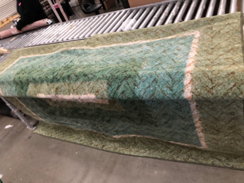 Photo 2 of **USED, NEEDS CLEANING**
7'9"FT X 14 FT GREEN, TEAL & TAN RUG