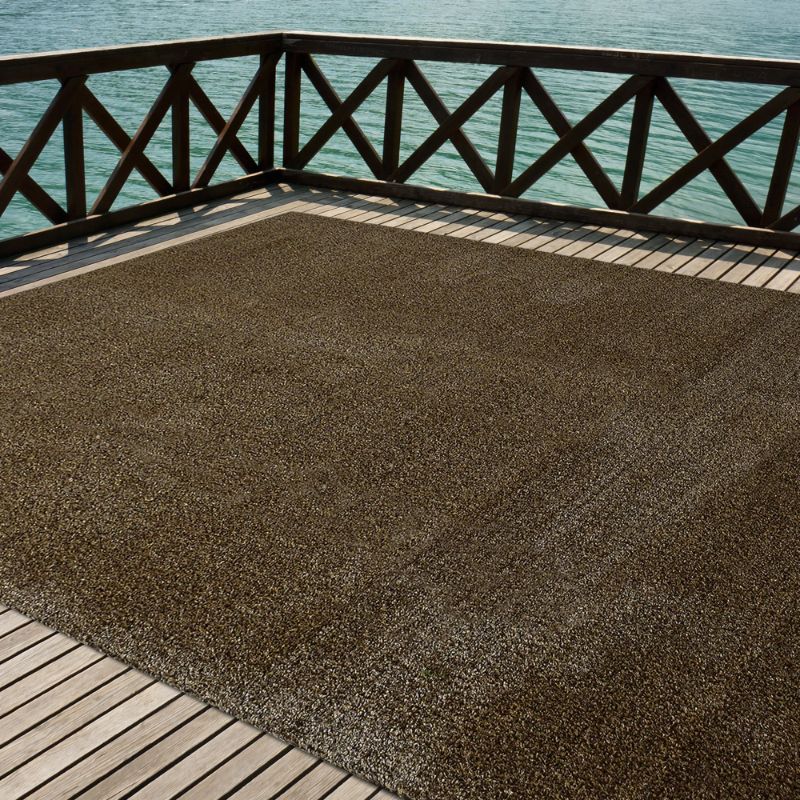 Photo 1 of 70" x 108" brown Artificial Turf area rug. (Estimated size)