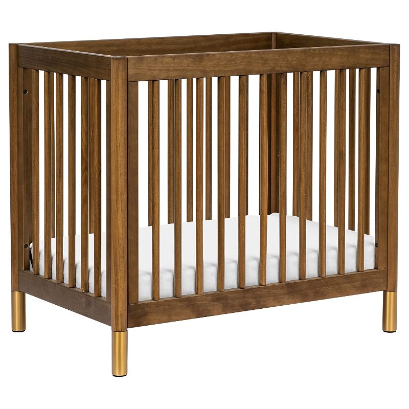 Photo 1 of Babyletto Gelato 4-in-1 Convertible Mini Crib in Natural Walnut and Brushed Gold Feet, Greenguard Gold Certified
