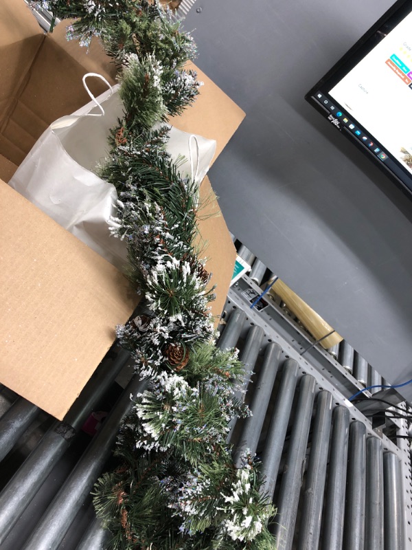 Photo 2 of National Tree Company Pre-Lit Artificial Christmas Garland, Green, Glittery Bristle Pine, White Lights, Decorated with Pine Cones, Battery Operated, Christmas Collection, 6 Feet
