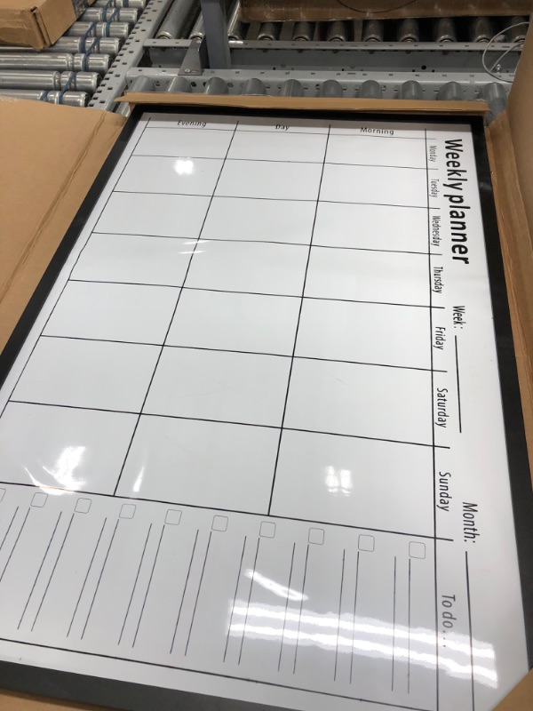 Photo 2 of Amazon Basics Magnetic Dry Erase White Board, 35 x 23-Inch Whiteboard - Black Wooden Frame 23"x35" Magnetic, Wood Frame