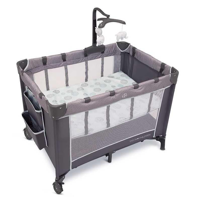 Photo 1 of Delta Children LX Deluxe Portable Baby Play Yard With Removable Bassinet and Changing Table, Eclipse
