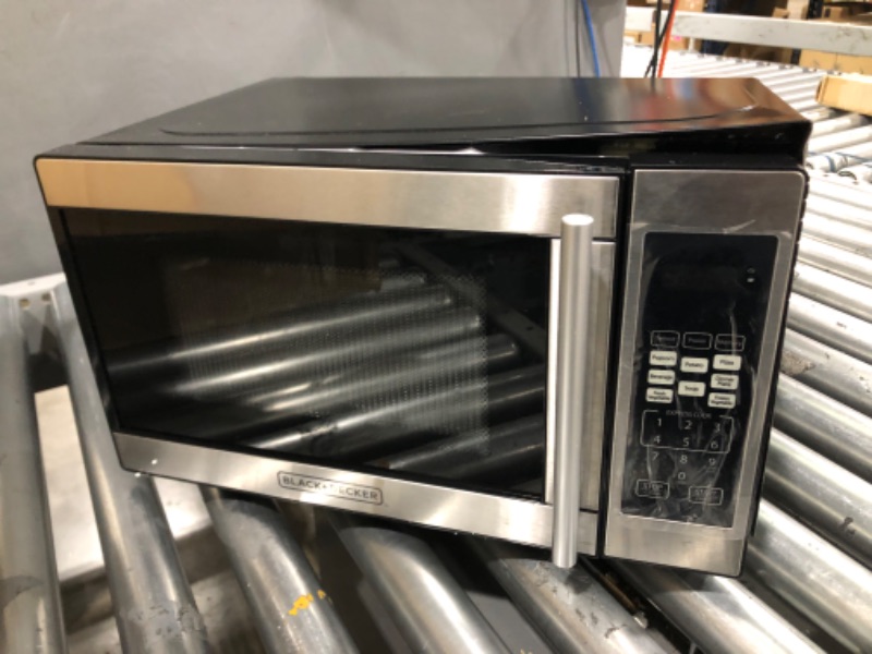 Photo 1 of (Parts Only - Major Damage) Black + Decker 0.7 Cubic Foot 700 Watt Stainless Steel Microwave with Turntable

