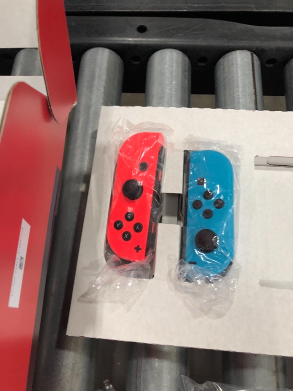 Photo 2 of Nintendo Switch with Neon Blue and Neon Red Joy?Con
