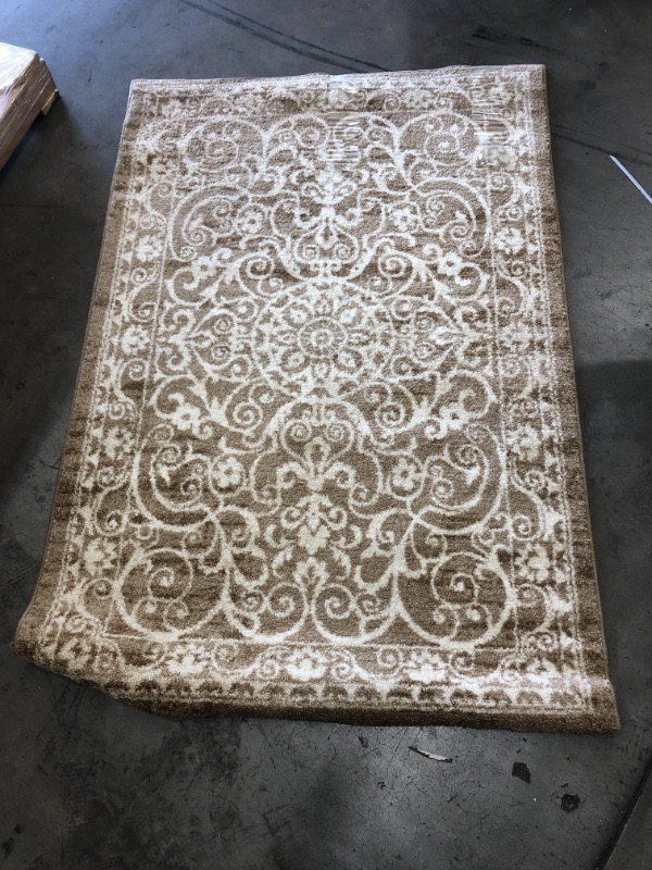 Photo 1 of 60 X 40 IN AREA RUG TAN AND WHITE COLORED 