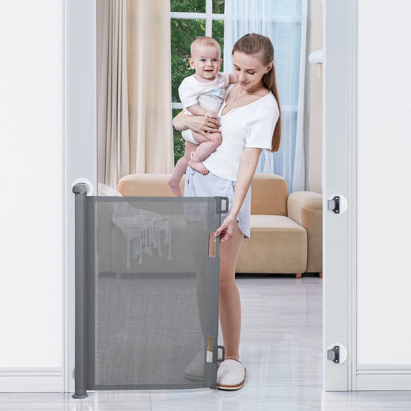 Photo 1 of  Retractable Baby Gates, Punch-Free Install Baby Gate Extra Wide 71” X 33” Tall for Kids or Pets Indoor and Outdoor Dog Gates for Doorways, Stairs, Hallways, Grey
