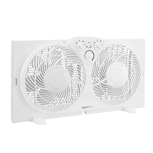 Photo 1 of Amazon Basics Window Fan with Manual Controls, Twin 9-Inch Reversible Airflow Blades
