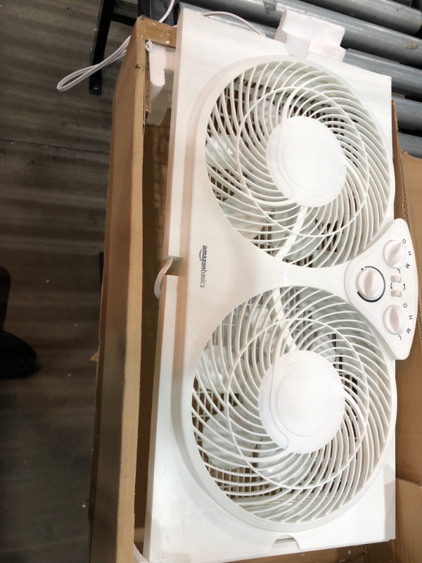 Photo 2 of Amazon Basics Window Fan with Manual Controls, Twin 9-Inch Reversible Airflow Blades
