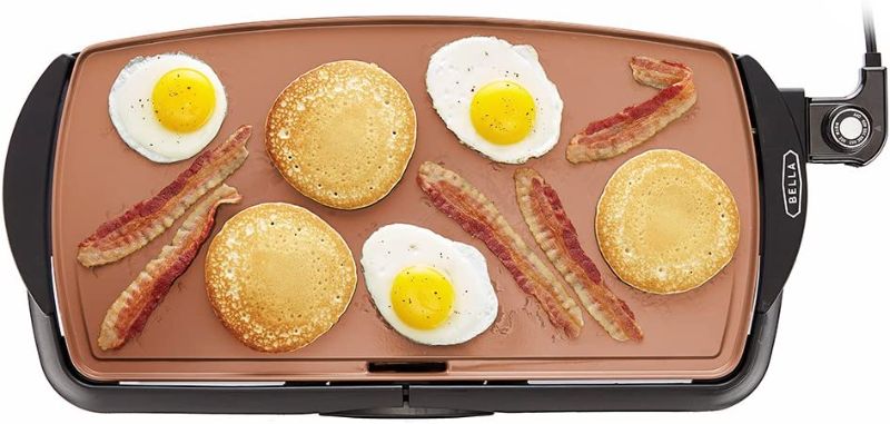 Photo 1 of *SEE NOTE-DAMAGE* BELLA Electric Ceramic Titanium Griddle, Make 10 Eggs At Once, Healthy-Eco Non-stick Coating, Hassle-Free Clean Up, Large Submersible Cooking Surface, 10.5" x 20", Copper/Black
