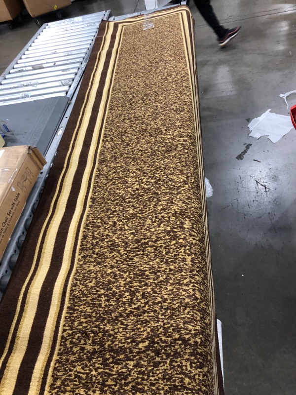 Photo 1 of 2'7"x8'9"  Brown rug 