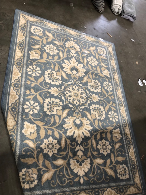 Photo 1 of 5'x7' blue/silver/gold rug