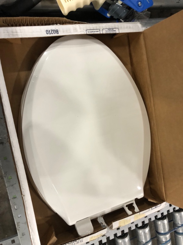 Photo 6 of **parts only, damaged, missing hardware**
Kohler 4636-0 Cachet Quiet-Close with Grip-Tight Elongated Toilet Seat - White