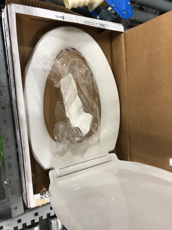 Photo 2 of **parts only, damaged, missing hardware**
Kohler 4636-0 Cachet Quiet-Close with Grip-Tight Elongated Toilet Seat - White