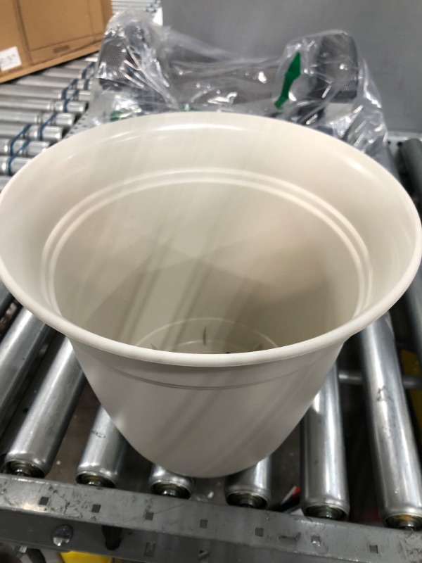 Photo 1 of 12' round tan plant pot