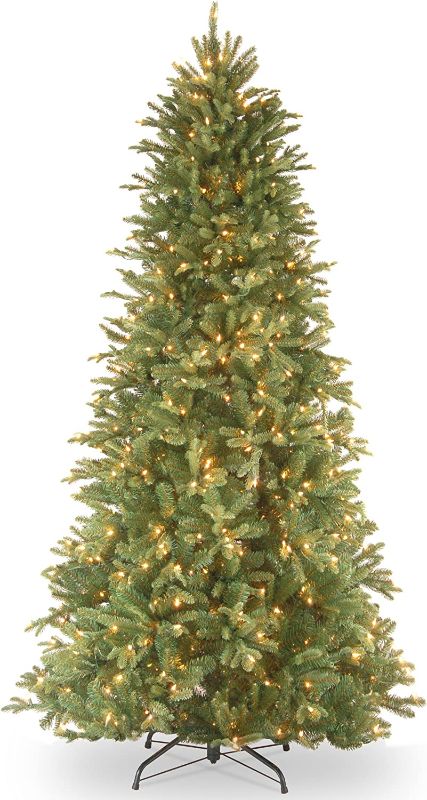 Photo 1 of National Tree Company Pre-Lit 'Feel Real' Artificial Slim Christmas Tree, Green, Tiffany Fir, White Lights, Includes Stand, 6.5 Feet
