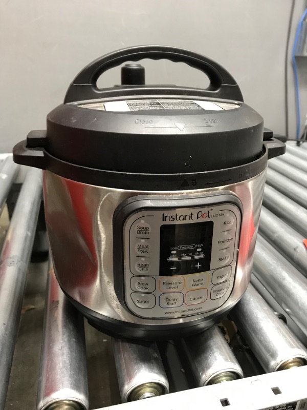 Photo 4 of (INCOMPLETE AND DAMAGED**Instant Pot Duo Mini 3-Quart Multi-Use Pressure Cooker
**MISSING POWER CORD, DENT**
