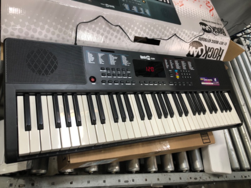 Photo 2 of RockJam Compact 61 Key Keyboard with Sheet Music Stand, Power Supply, Piano Note Stickers & Simply Piano Lessons
