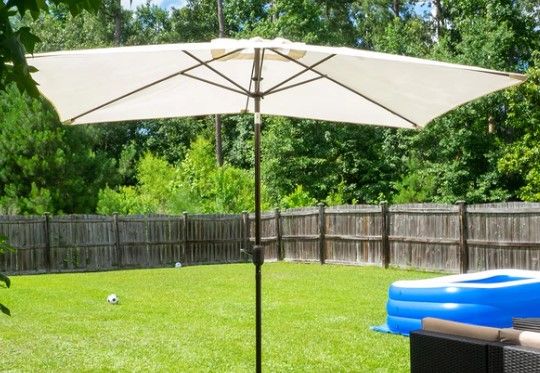 Photo 1 of 6.5 by 10 Ft Rectangular Market Umbrella with Push Button Tilt and Crank - Beige
