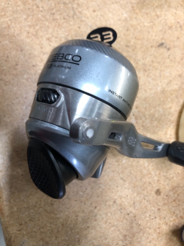 Photo 3 of **MINOR DAMAGE TO HANDLE** Zebco 33 Platinum Spincast Reel, 5 Ball Bearings (4 + Clutch), Instant Anti-Reverse with a Smooth Dial-Adjustable Drag, Powerful All-Metal Gears and Spooled with 10-Pound Cajun Line

