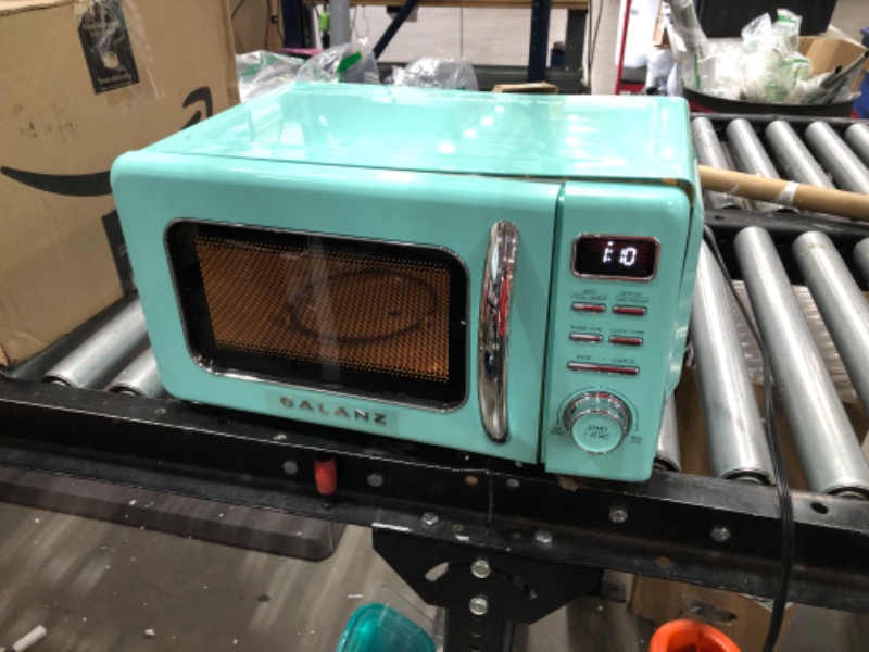 Photo 4 of (NOT FUNCTIONAL; DENTED )Galanz GLCMKZ07BER07 Retro Countertop Microwave Oven with Auto Cook & Reheat, Defrost, Quick Start Functions, Easy Clean with Glass Turntable, Pull Handle.7 cu ft, Blue
