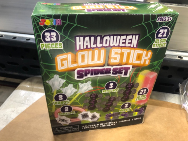 Photo 1 of JOYIN 33 Pcs Halloween Glow Sticks Bulk Spider Themed Light Up Party Supplies with 3 Necklaces, 3 Rings, 3 Wands, 3 Bracelets, 21 Glow Sticks for Halloween Glow in the Dark Party Favors