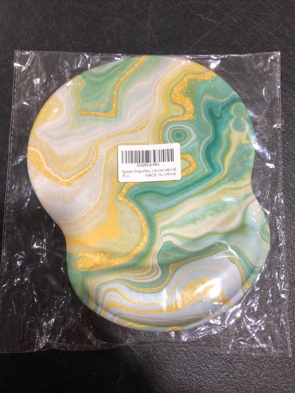 Photo 1 of ERGONOMIC MOUSE PAD. GREEN WITH GOLD. 
