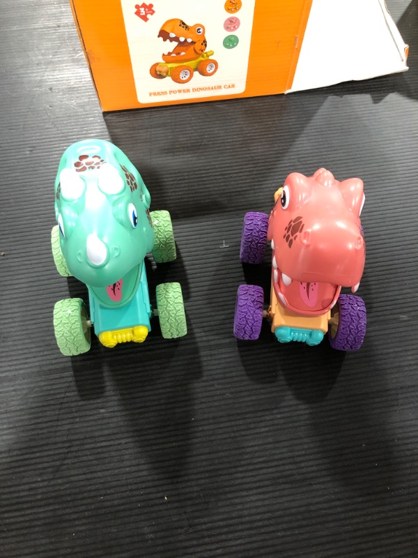 Photo 2 of Dinosaur Toy car for 3 4 5 Year Old boy Toy Truck 2 Pack Monster Truck (Triceratops Green + Tyrannosaurus Pink)
