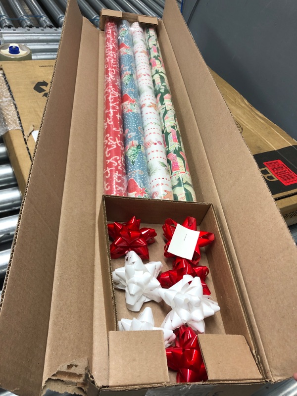 Photo 1 of 4 rolled Christmas wrapping with 8 bows 