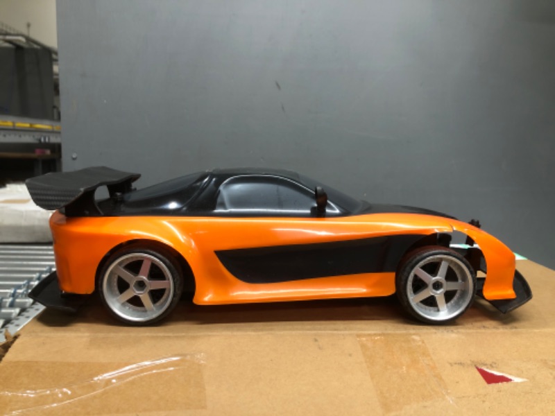 Photo 1 of 
Jada Toys Fast & Furious Han’s Mazda RX-7 Drift RC Car, 1: 10 Scale 2.4Ghz Remote Control Orange & Black, Ready to Run, USB Charging (Standard) (99700)
