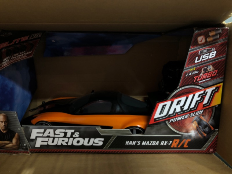 Photo 8 of 
Jada Toys Fast & Furious Han’s Mazda RX-7 Drift RC Car, 1: 10 Scale 2.4Ghz Remote Control Orange & Black, Ready to Run, USB Charging (Standard) (99700)
