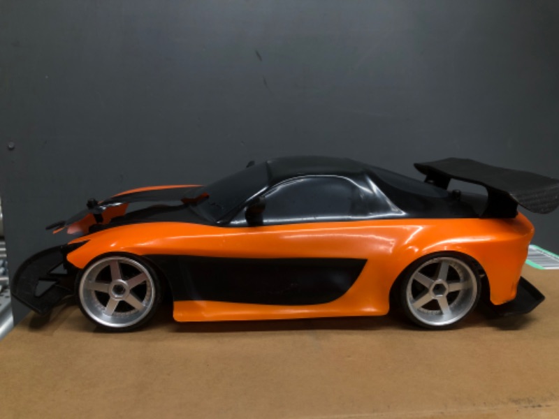Photo 4 of 
Jada Toys Fast & Furious Han’s Mazda RX-7 Drift RC Car, 1: 10 Scale 2.4Ghz Remote Control Orange & Black, Ready to Run, USB Charging (Standard) (99700)

