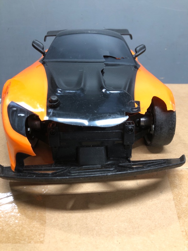 Photo 3 of 
Jada Toys Fast & Furious Han’s Mazda RX-7 Drift RC Car, 1: 10 Scale 2.4Ghz Remote Control Orange & Black, Ready to Run, USB Charging (Standard) (99700)
