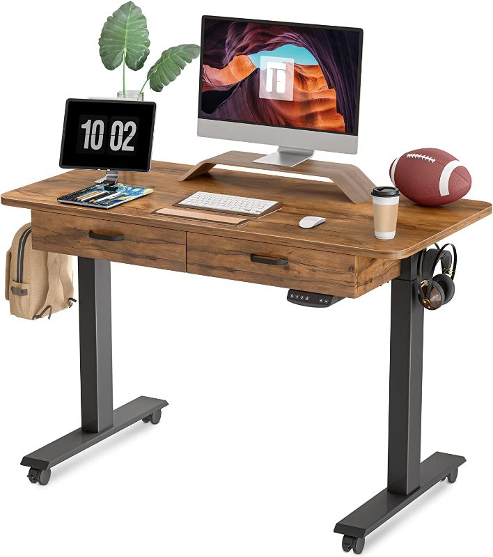 Photo 1 of FEZIBO Standing Desk with Double Drawer, 48x 24 Inches Adjustable Height Electric Stand up Desk, Ergonomic Workstation Black Frame/Fir Brown Top
