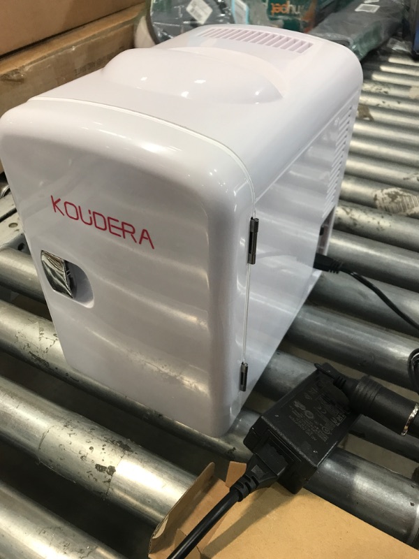 Photo 2 of **** USED ****
KOUDERA 4L Mini Portable Compact Personal Fridge Cooler and Warmer with AC DC Power, Small Refrigerator for Skincare, Breast Milk - Home and Travel- Gift - Freon-Free and Eco Friendly, White.